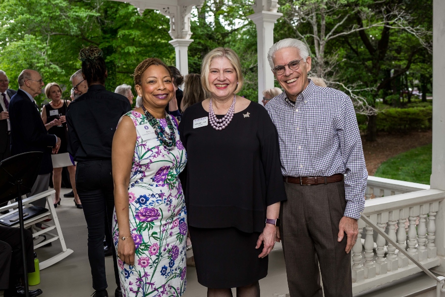 The president of Agnes Scott College poses for a photo with two donors. 