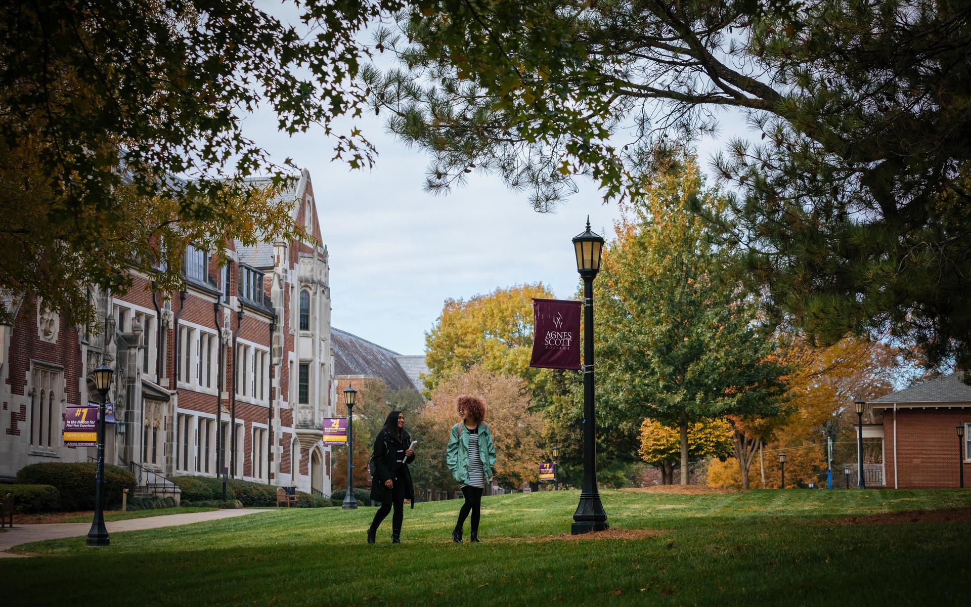 Two students walking on the campus quad