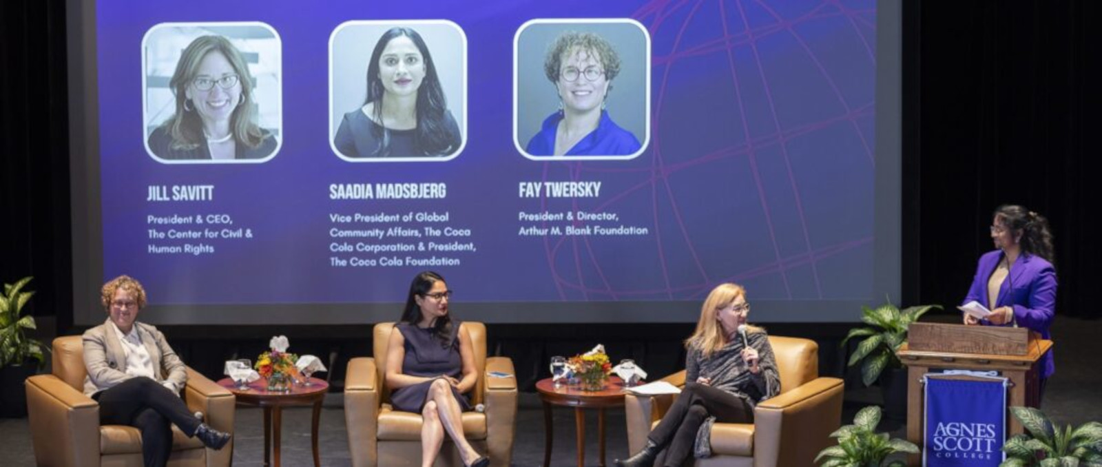 Two panelists and moderator at Women's Global Leadership Conference